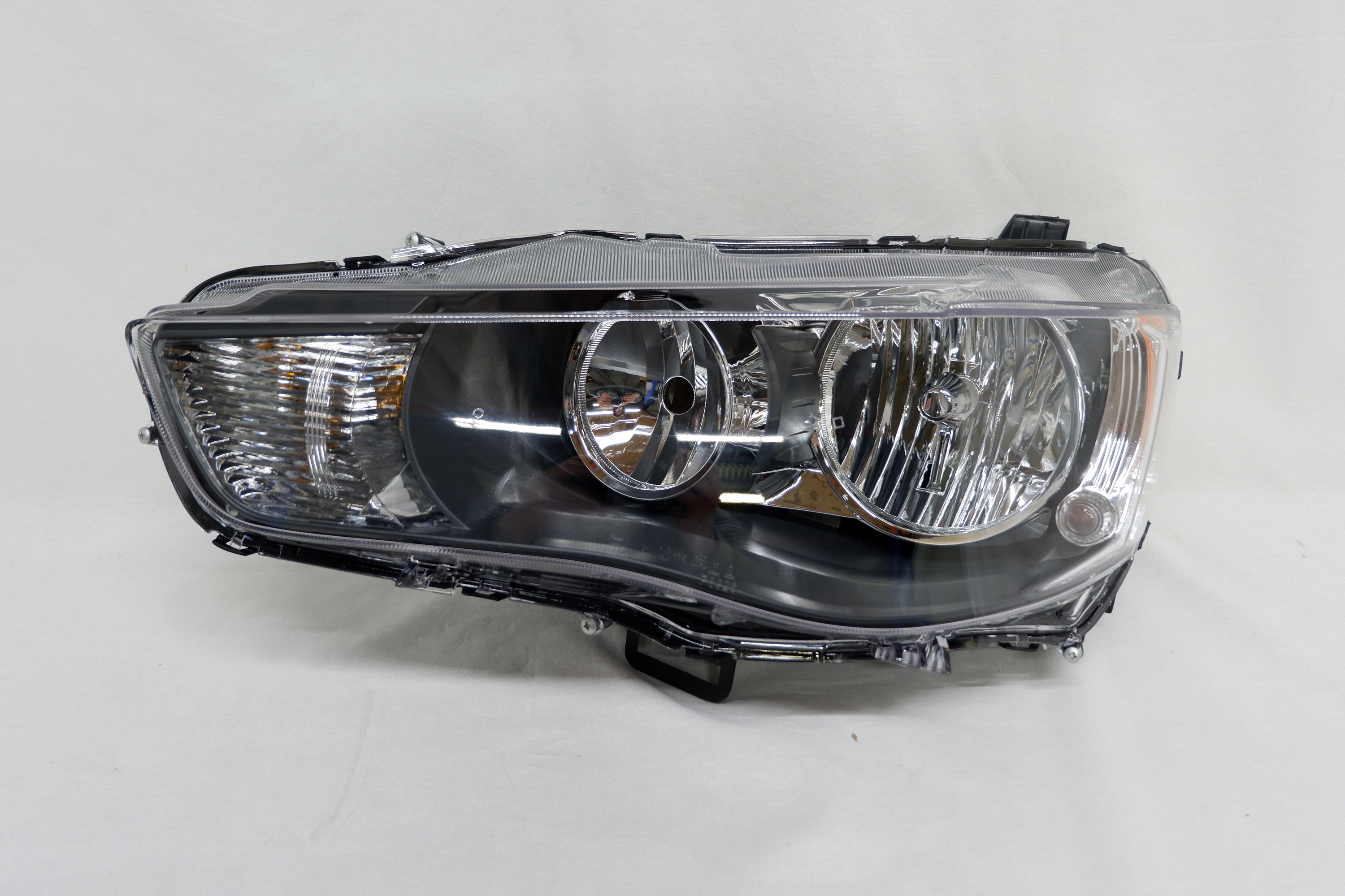 Фара левая Mitsubishi Outlander 2 XL (2009-2012)